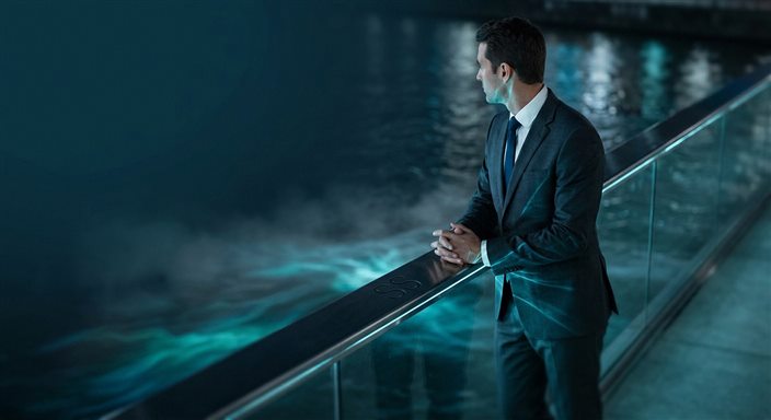 Player with cards at gaming table